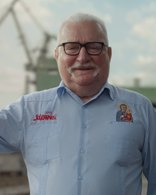 Lech Wałęsa against the port cranes of the Gdańsk Shipyard.