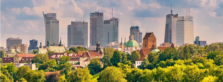 Warsaw skyline with historic buildings and modern skyscrapers.